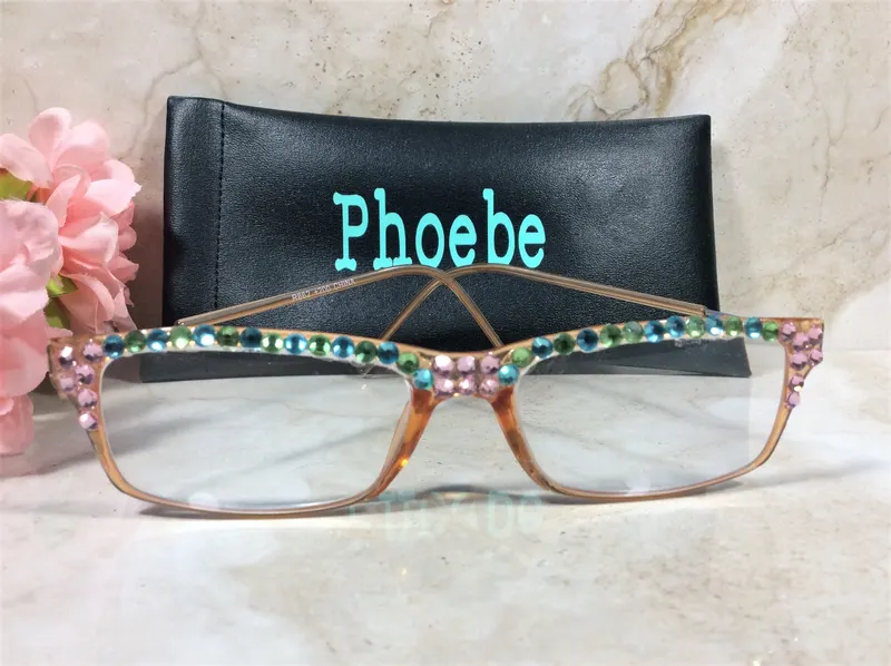 DAZZLING READERS with Aqua and Pink Crystals. Designer style in a Peach colored frame. FREE Faux Leather Case with a Nam