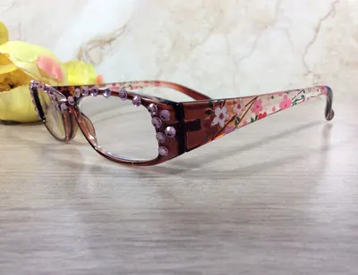 GENUINE PINK CRYSTALS shine and shimmer. Gradient color scheme on the arms with flower scene. Free Snap Shut case with y