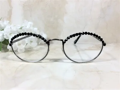 GENUINE BLACK CRYSTALS are so pretty on this classic reader. High quality and clarity. Free Faux Leather Case with a Nam