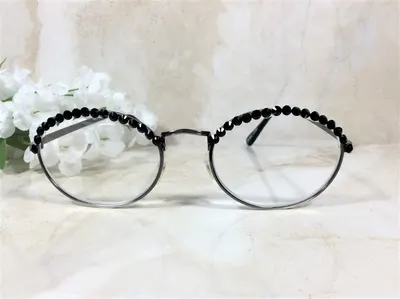 GENUINE BLACK CRYSTALS are so pretty on this classic reader. High quality and clarity. Free Faux Leather Case with a Nam